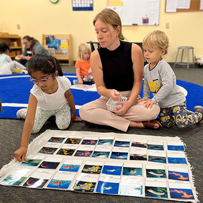 Montessori teacher with students
